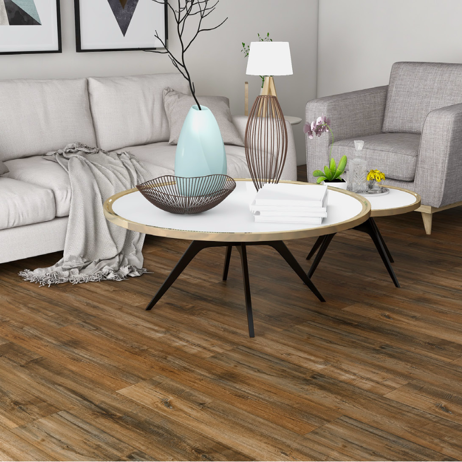 Modern living room with a gray sofa, armchair, and round coffee table.
