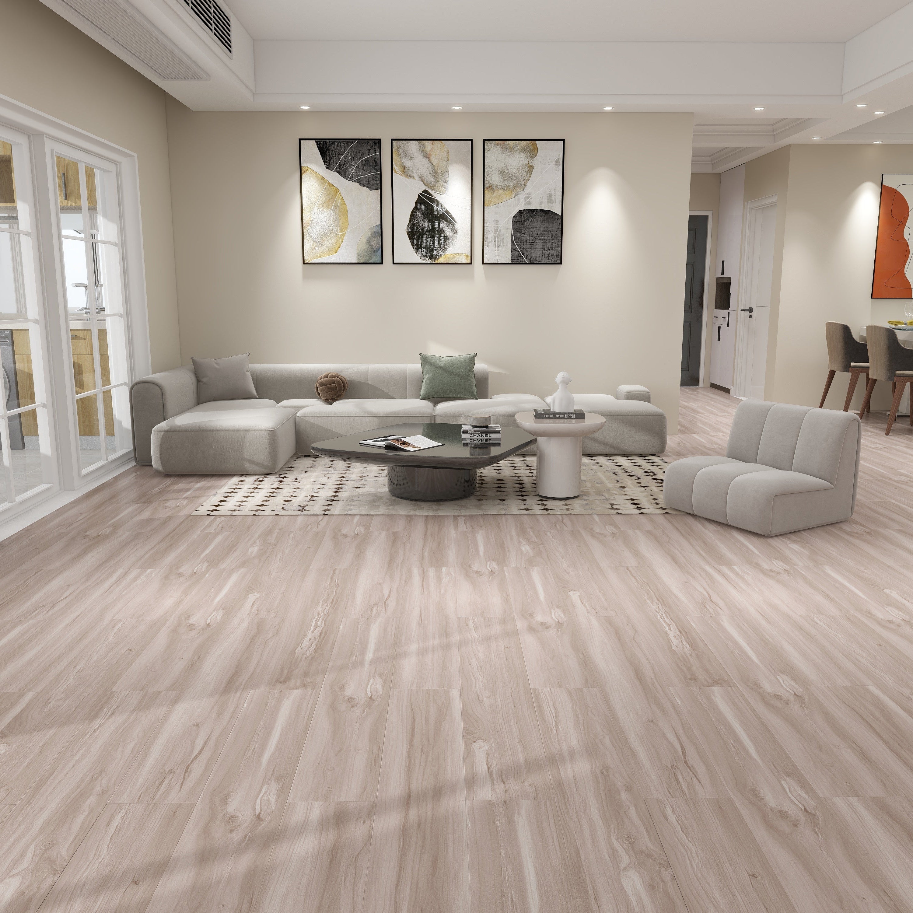 Modern living room with gray sectional sofa, coffee table, and decorative elements.